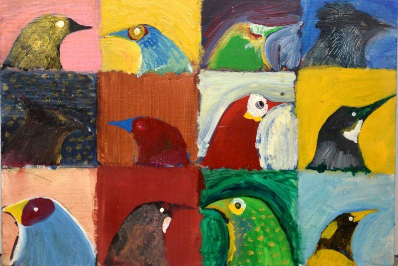 A detailed view of artist Joe Kelley's "The Natural History of the Undescribed Birds," 1993-2016, 哪个是12个正方形的鸟的脸, 每个人都转过身去, 有的朝左，有的朝右. 正方形有不同颜色的背景，每只鸟都是不同的颜色组合.